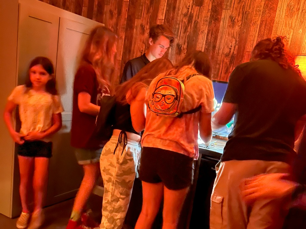 Kids working together to solve puzzles in an escape room at Worlds Away Escape in Winchester VA