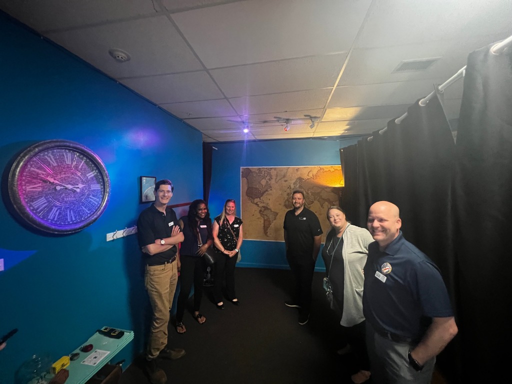 Group of players inside an immersive escape room at Worlds Away Escape in Winchester VA